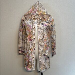 This is a Rodarte for Target beige floral hooded raincoat.